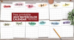 12 printable monthly calendars with a watercolor graphic in every color fo the rainbow behind the month at the top of the undated monthly calendars.