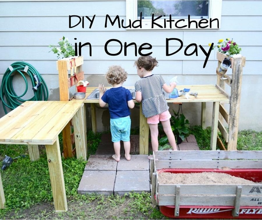2 young girls playong in a DIY Mud kitchen